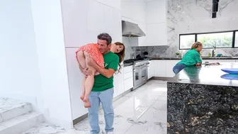 Stepdaughter Mira Monroe kneels behind counter to suck stepdad's thick cock