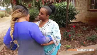 Two busty ebony lesbians pleasure each other with a double dildo